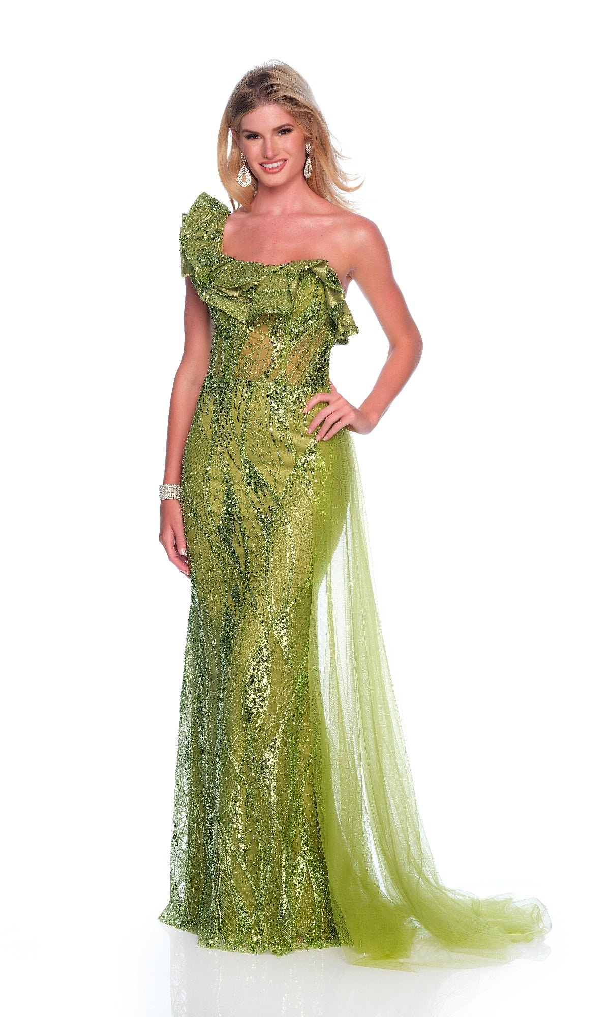 A woman models the Dave & Johnny 12226 long green prom dress featuring a one-shoulder design with sequins, ruffle detail, and sheer accents against a white background.